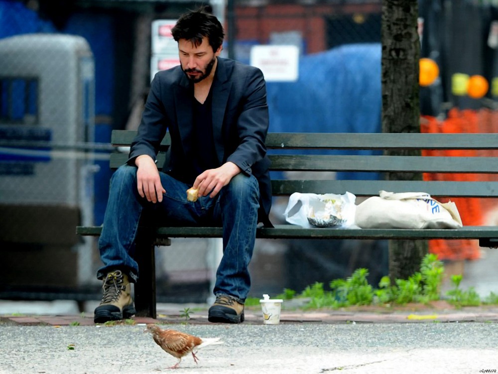 keanu-reeves-lonely-bench-street